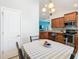 View from dining area with sightlines into the kitchen at 649 Meadow Pointe Dr, Haines City, FL 33844