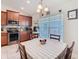 Bright dining nook with a window and views into the kitchen at 649 Meadow Pointe Dr, Haines City, FL 33844