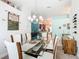 Dining room with a glass table and views into the kitchen at 649 Meadow Pointe Dr, Haines City, FL 33844