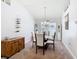 Dining room with carpet, chandelier, and a wine rack at 649 Meadow Pointe Dr, Haines City, FL 33844