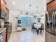 Bright eat-in kitchen featuring modern appliances and a dining area at 649 Meadow Pointe Dr, Haines City, FL 33844