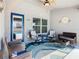 Cozy lanai area with comfortable seating, a ceiling fan, and an accent rug for relaxing outdoors at 649 Meadow Pointe Dr, Haines City, FL 33844