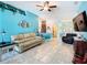 Spacious living room showcasing the open floor plan and turquoise accent wall at 649 Meadow Pointe Dr, Haines City, FL 33844