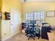 Cozy home office space with natural light and traditional wall decor at 649 Meadow Pointe Dr, Haines City, FL 33844