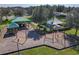 Community playground with swings, climbing structures, and shaded picnic areas at 649 Meadow Pointe Dr, Haines City, FL 33844