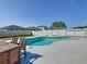 Private backyard oasis with a sparkling pool, dining area, and well-kept landscaping at 649 Meadow Pointe Dr, Haines City, FL 33844