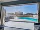 Inviting backyard oasis featuring a sparkling pool, outdoor dining, and well-maintained landscaping at 649 Meadow Pointe Dr, Haines City, FL 33844