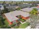 Aerial view of a neighborhood with single Gathering homes featuring mature trees, lush landscaping, and well-maintained lawns at 651 Highlands Hammock Dr, Poinciana, FL 34759