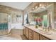 Bathroom featuring a soaking tub, shower, double vanity, and modern lighting at 651 Highlands Hammock Dr, Poinciana, FL 34759