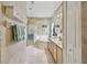 Bright bathroom featuring a soaking tub, double vanity, and tiled floors at 651 Highlands Hammock Dr, Poinciana, FL 34759
