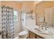 Cozy bathroom featuring a shower, toilet, and vanity with a sink at 651 Highlands Hammock Dr, Poinciana, FL 34759