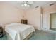 Spacious bedroom featuring a ceiling fan and natural light at 651 Highlands Hammock Dr, Poinciana, FL 34759