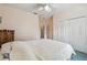 Bedroom with a closet and ceiling fan at 651 Highlands Hammock Dr, Poinciana, FL 34759