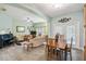 Open-concept living and dining area featuring modern furniture and ample light at 651 Highlands Hammock Dr, Poinciana, FL 34759