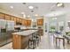 Spacious kitchen featuring granite countertops, stainless steel appliances, and an eat-in breakfast nook at 651 Highlands Hammock Dr, Poinciana, FL 34759