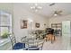 Bright living area has a ceiling fan, neutral paint, tile floor, and comfortable seating, with adjacent doorway to the bedroom at 651 Highlands Hammock Dr, Poinciana, FL 34759