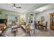 Inviting living room featuring a neutral color palette, tile flooring, and access to the outdoor patio at 651 Highlands Hammock Dr, Poinciana, FL 34759