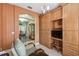Home office space with custom built in cabinets and view to the dining area at 651 Highlands Hammock Dr, Poinciana, FL 34759