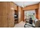 Cozy office space with a desk, and a custom built in cabinet at 651 Highlands Hammock Dr, Poinciana, FL 34759