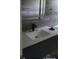 Bathroom featuring modern fixtures, a gray tiled wall, and a vanity at 717 Michigan Ct # 2, St Cloud, FL 34769