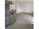 This kitchen features stainless steel appliances and gray tile flooring at 717 Michigan Ct # 2, St Cloud, FL 34769