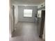 A kitchen with gray cabinets, stainless steel appliances, and light gray flooring at 717 Michigan Ct # 2, St Cloud, FL 34769