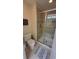 Modern bathroom includes tile flooring, a glass enclosed shower and fixtures at 8974 California Palm Rd, Kissimmee, FL 34747