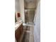 Stylish bathroom features granite counters, tile shower, commode, wall art, and tile flooring at 8974 California Palm Rd, Kissimmee, FL 34747