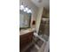 Well-appointed bathroom featuring granite counters, tile shower, and modern fixtures at 8974 California Palm Rd, Kissimmee, FL 34747