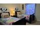Bedroom features two twin beds with colorful bedding, creating a fun and inviting space at 8974 California Palm Rd, Kissimmee, FL 34747