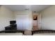 Neutral bedroom features closet, TV, and twin beds, offering a comfortable and inviting space at 8974 California Palm Rd, Kissimmee, FL 34747