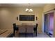 Charming dining room with seating for six and stylish chandelier, perfect for Gathering meals at 8974 California Palm Rd, Kissimmee, FL 34747