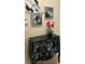 Close-up of a beautifully decorated black dresser with red flowers in a vase at 8974 California Palm Rd, Kissimmee, FL 34747