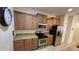 Modern kitchen with stainless steel appliances and granite countertops at 8974 California Palm Rd, Kissimmee, FL 34747