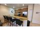 Well-equipped kitchen with breakfast bar and modern appliances at 8974 California Palm Rd, Kissimmee, FL 34747