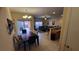 Bright open-concept living space with tile floors, and sliding glass doors leading to the patio at 8974 California Palm Rd, Kissimmee, FL 34747