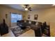 Bright and airy living room with a large sectional sofa and dining area in the background at 8974 California Palm Rd, Kissimmee, FL 34747