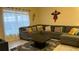 Cozy living room features a large sectional sofa, perfect for relaxing and entertaining at 8974 California Palm Rd, Kissimmee, FL 34747