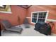 Private patio with lounge chairs and grill, ideal for relaxing and outdoor cooking at 8974 California Palm Rd, Kissimmee, FL 34747
