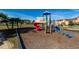 Community playground featuring a colorful slide and climbing structure, perfect for to enjoy outdoor fun at 8974 California Palm Rd, Kissimmee, FL 34747