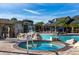 Resort-style pool with a jacuzzi, waterfall feature, and inviting lounge area, perfect for relaxation at 8974 California Palm Rd, Kissimmee, FL 34747