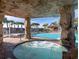 Luxurious pool area with hot tub and waterfall feature, perfect for relaxation and entertainment at 8974 California Palm Rd, Kissimmee, FL 34747