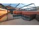 Screened-in pool area with protective fencing, ensuring safety and relaxation for the whole Gathering at 8974 California Palm Rd, Kissimmee, FL 34747