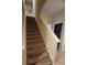 Carpeted staircase with a railing, providing a safe and stylish transition between floors at 8974 California Palm Rd, Kissimmee, FL 34747
