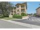 Exterior of residential building featuring dual balconies and lush landscaping at 901 Charo Pkwy # 731, Davenport, FL 33897