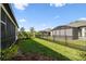 Well-maintained backyard with lush grass and black metal fence at 937 Walnut Creek Ln, Poinciana, FL 34759