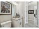 Bathroom featuring granite countertop vanity, large mirror, and modern fixtures at 937 Walnut Creek Ln, Poinciana, FL 34759