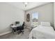 Cozy bedroom featuring a comfortable single bed, desk, and stylish decor at 937 Walnut Creek Ln, Poinciana, FL 34759