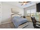 Comfortable bedroom featuring neutral decor, plush carpet, ceiling fan, and a beautiful backyard view at 937 Walnut Creek Ln, Poinciana, FL 34759
