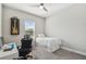Well-lit bedroom with comfortable carpeting and a window; ideal for a home office or bedroom at 937 Walnut Creek Ln, Poinciana, FL 34759